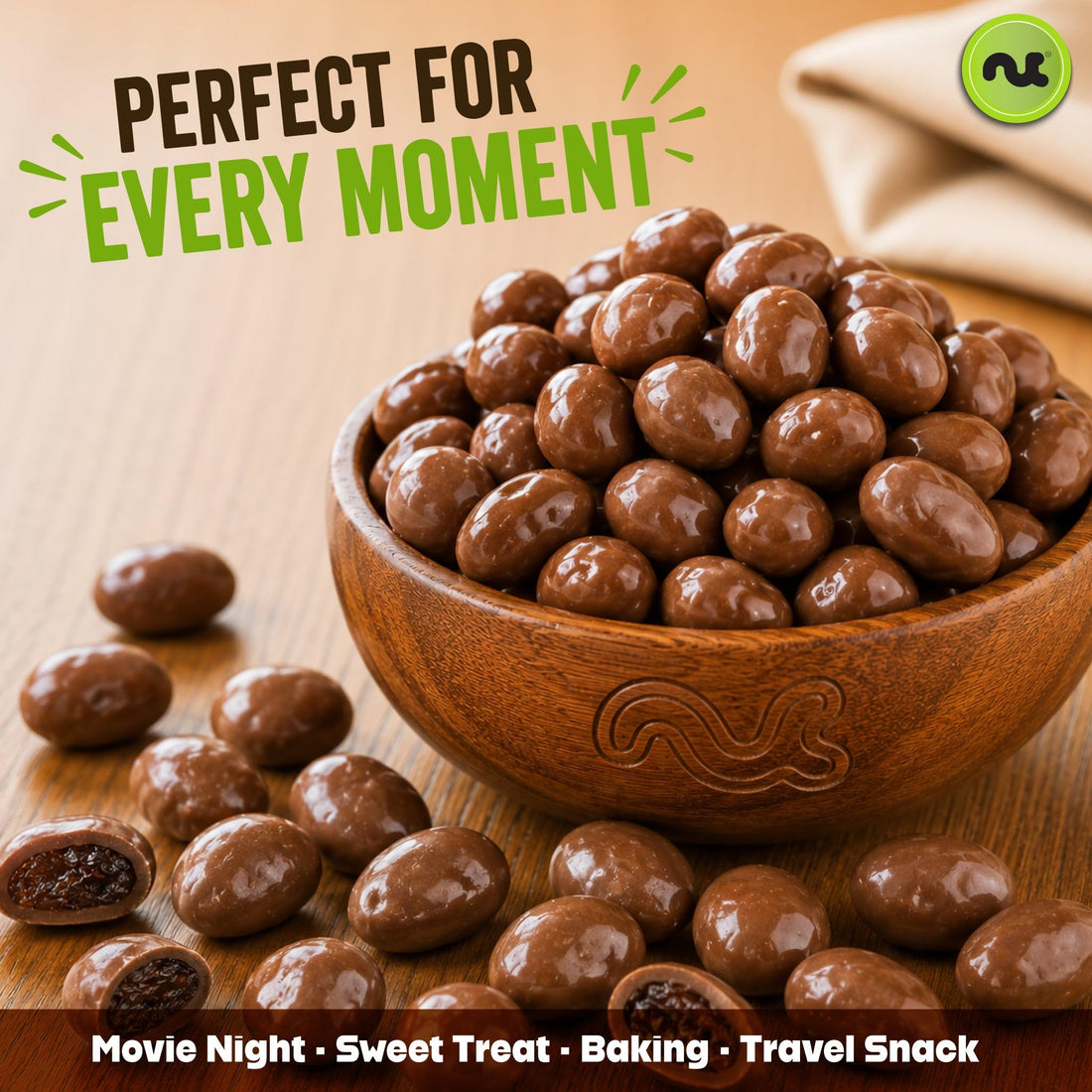 Milk chocolate covered raisins in a wooden bowl, a sweet-and-chewy gorp ingredient