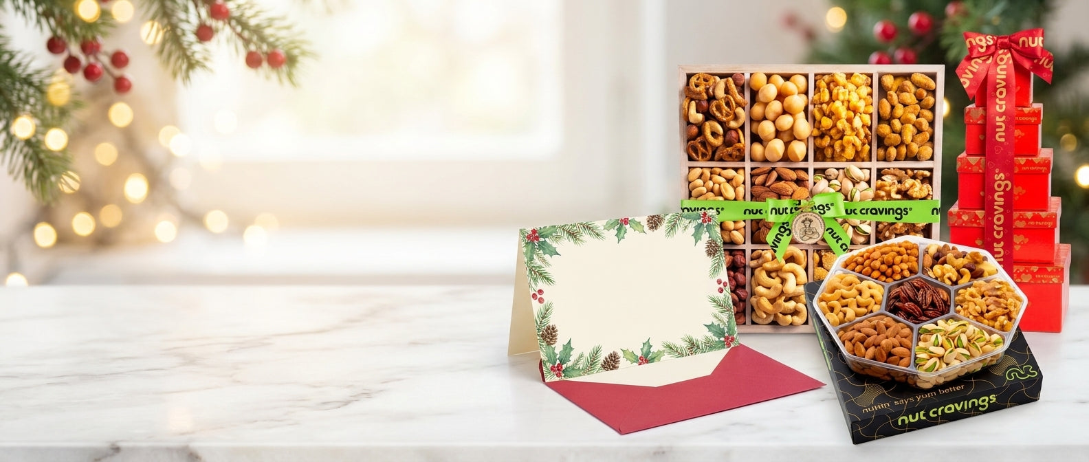 Nut Cravings holiday gift trays and red gift tower on marble with a free custom printed holiday greeting card and red envelope